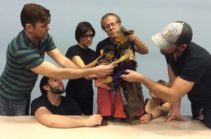 The Rogue Theatre ensemble members exploring FST puppets.