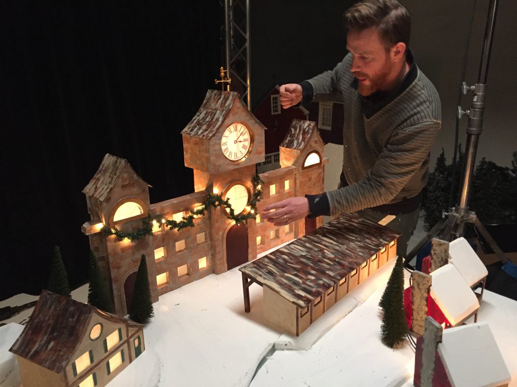 Puppet Set Designer John Sundling puts the final touches on Santa's Workshop